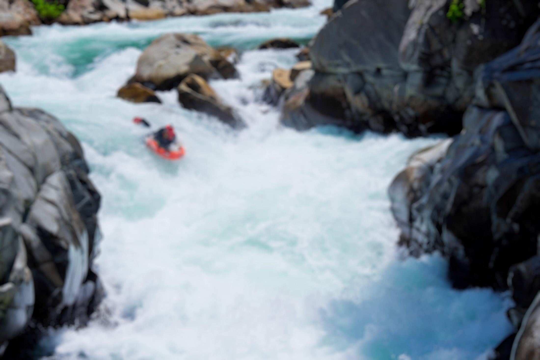 Riverboarder dropping into turquoise whitewater, Kiyotsu Gorge, Japan